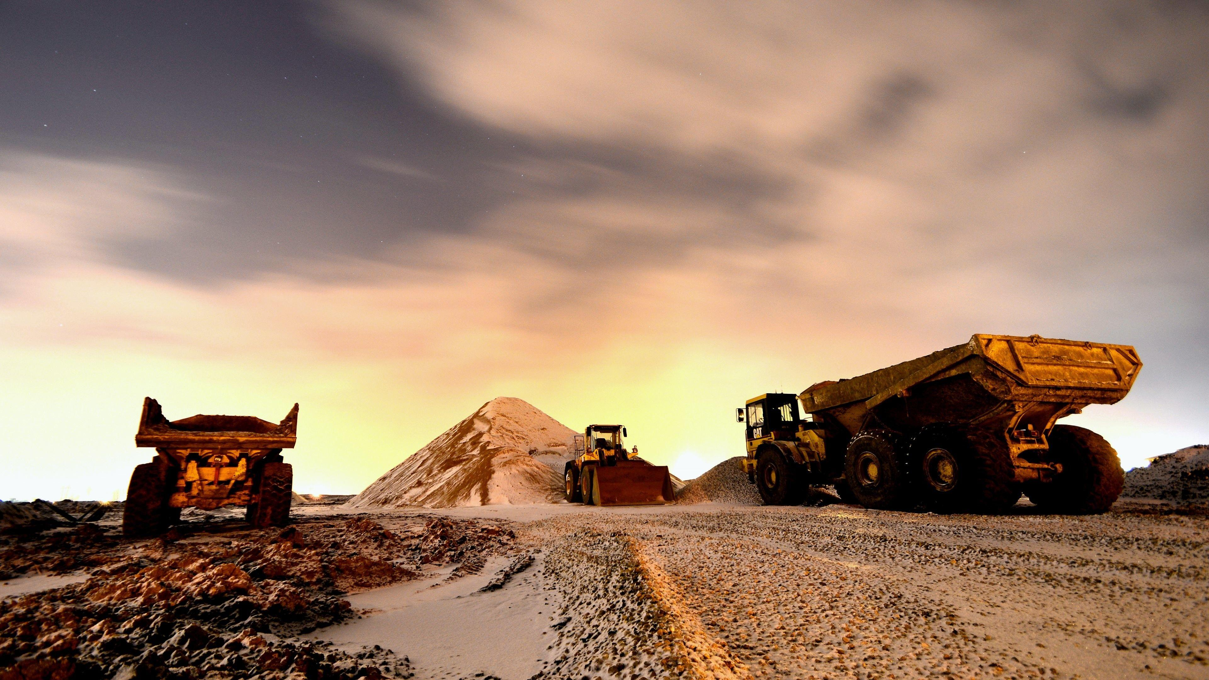 Mining machinery and excavation team working in daylight